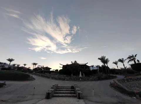 Tropical resort landscape at sunset with dramatic clouds 写真素材