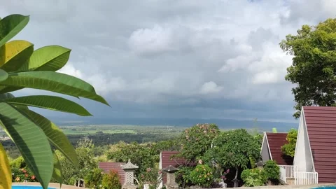Tropical Resort View with A-Frame Cottages and Cloudy Valley Stock Footage 340465443