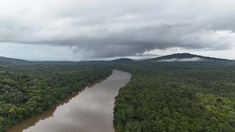 Tropical River Under Cloudy Sky. Stock Photos