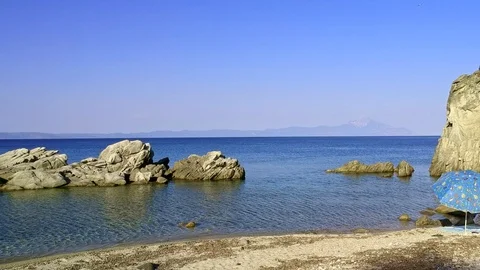 Tropical sandy beach with large rocks and blue sea Stock Footage 91070238