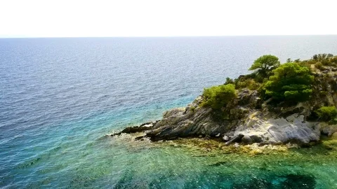 Tropical sandy beach with large rocks and blue sea Stock Footage 91070268