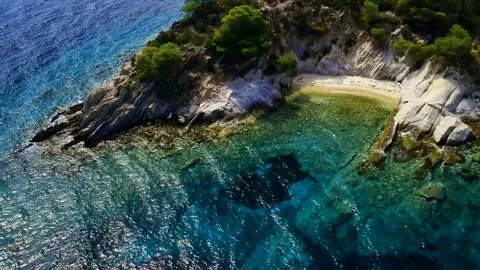 Tropical sandy beach with large rocks and blue sea Stock Footage 91070281