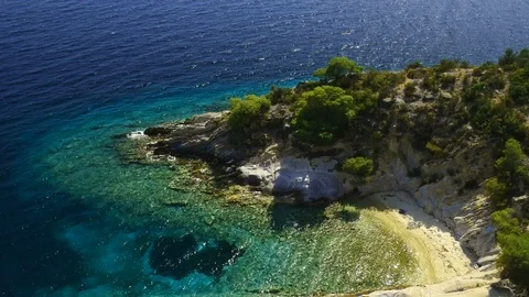 Tropical sandy beach with large rocks and blue sea Stock Footage 91070378