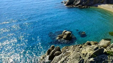 Tropical sandy beach with large rocks and blue sea Stock Footage 91070473
