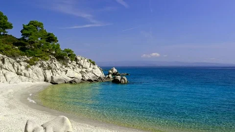 Tropical sandy beach with large rocks and blue sea Stock Footage 91070484