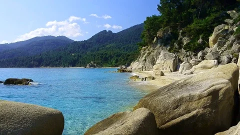 Tropical sandy beach with large rocks and blue sea Stock Footage 91070513
