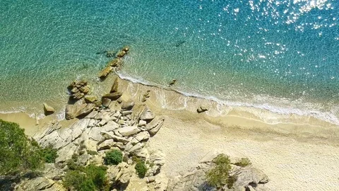Tropical sandy beach with large rocks and blue sea Stock Footage 91070521