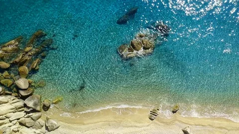 Tropical sandy beach with large rocks and blue sea Stock Footage 91070566