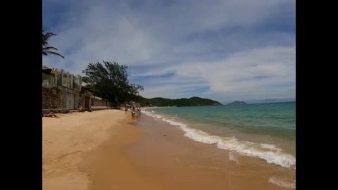 Tropical Serenity: Pristine Beach with Clear Water Stock Footage 300596083