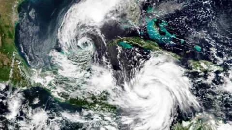 Tropical Storm Gamma (left) and Hurricane Delta (right) hurricane view  space Stock Footage 237239291