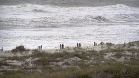 A tropical storm with rough ocean surf and rip tides on Amelia Island in Florida Stock Footage 129268056