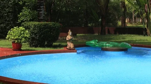 Tropical summer rain falling big drops on swimming pool , Thailand Stock Footage 80124106