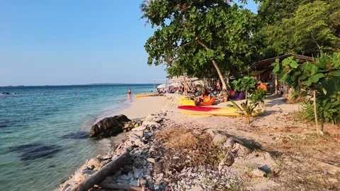 Tropical sunset beach bar atmosphere on Karimunjawa Island, Indonesia. Tourists Stock Footage 342314364