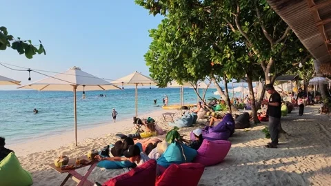 Tropical sunset beach bar atmosphere on Karimunjawa Island, Indonesia. Tourists Stock Footage 342314599