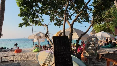 Tropical sunset beach bar atmosphere on Karimunjawa Island, Indonesia. Tourists Stock Footage 342314756