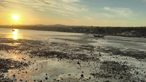Tropical Sunset Over Beach at Low Tide with Fishing Boats Stock Footage 340464925