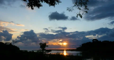 Tropical Sunset Sky Colored Clouds With Sun Ray Shining Through Over The Water Stock Footage 138073432