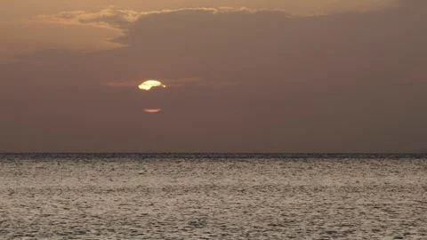 Tropical sunset with sun goes down behind the clouds. Stock Footage 331124498