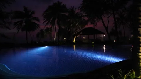 Tropical Sunset Swimming Pool Stock Footage