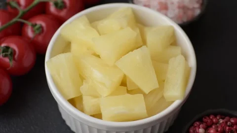 Tropical sweet tinned pineapple fruit sliced into slices Stock Footage 306474073
