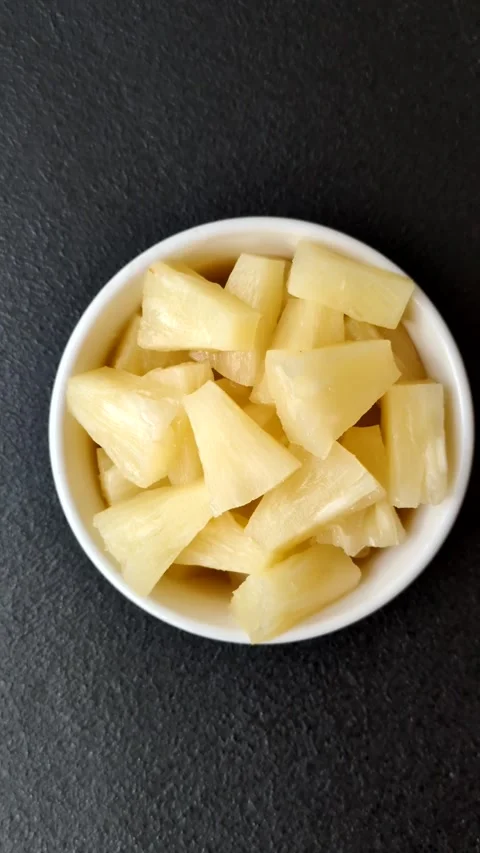 Tropical sweet tinned pineapple fruit sliced into slices Stock Footage 306474150