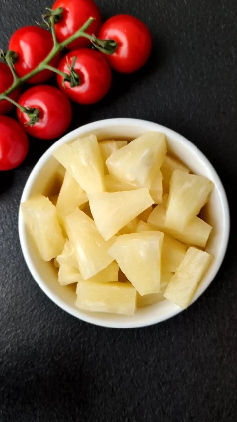 Tropical sweet tinned pineapple fruit sliced into slices Stock Footage 306474155