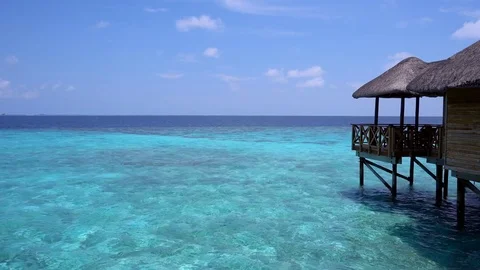 Tropical travel card with water bungalows Stock Footage
