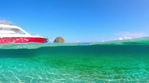 Tropical vacation at sea, split shot of an exotic beach in Indonesia, Bali beach Stock Footage 246017347