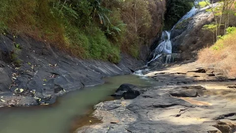 Tropical Waterfall Cascading into River Stream, Rocky Canyon, Crane Shot Video stock 324769833