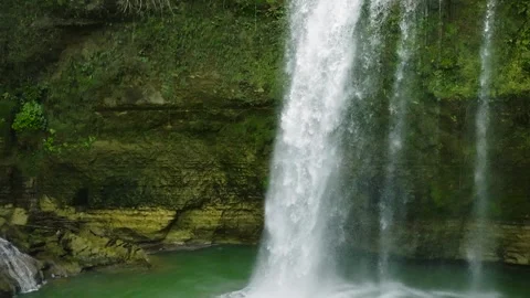 A tropical waterfall in a mountain canyon. Stock Footage 284928549