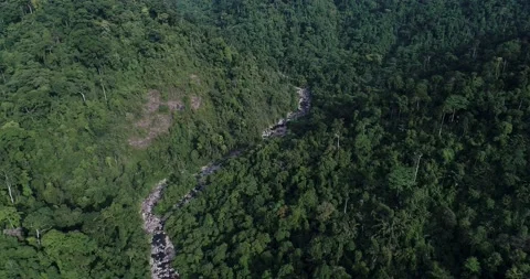 Tropical waterfall rainforest in deep mountain with rocky aerial view Stock Footage 134450322