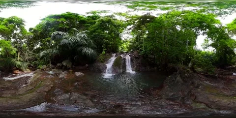 A tropical waterfall. Virtual Reality 360. 8k Video. Stock Footage 204885933