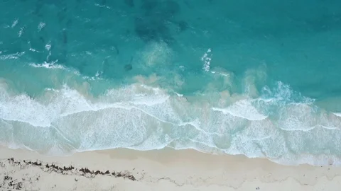 Tropical waves on a white sand beach: 4K Aerial drone footage	 Stock Footage