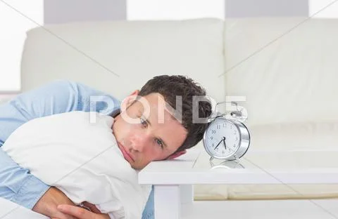 Troubled casual man resting head on table Stock Photos