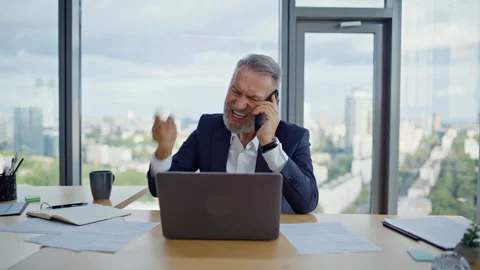 Troubled ceo yelling cellphone looking laptop closeup. Angry mature businessman Stock Footage 319964887