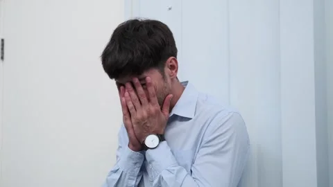 Troubled Man Experiencing Concerns in the Office Stock Footage 254440723