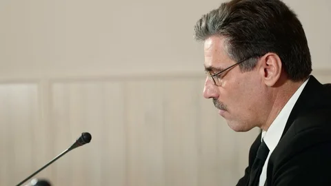 Troubled speaker attentively listens to a question from the journalist at a Stock Footage 101794958