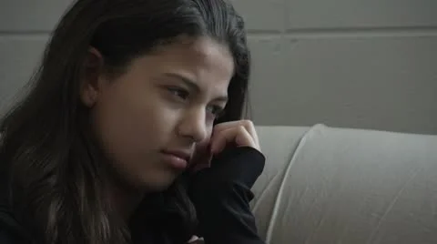 Troubled teen upset on the couch Stock Footage