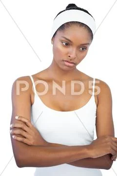 Troubled woman with headband crossing her arms Stock Photos