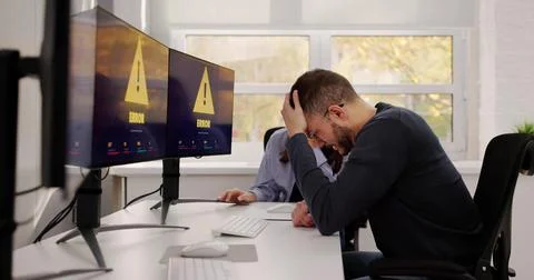 Troubleshooting A System Error On The Computer Software Screen. A Hacker Brea Stock Photos