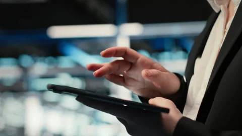 Troubleshooting, tablet closeup and admin in data center Stock Footage 329331495