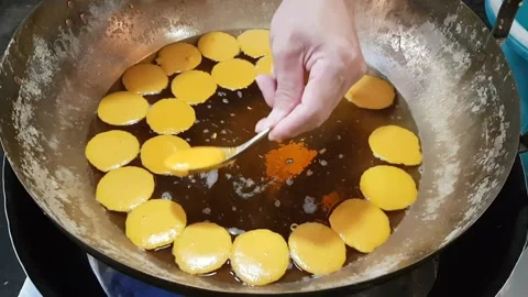 Trouxas das Caldas or The process of producing egg yoke fudge balls or Thon.. Stock Footage 227103737