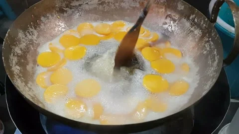 Trouxas das Caldas or The process of producing egg yoke fudge balls or Thon.. Stock Footage 227103767