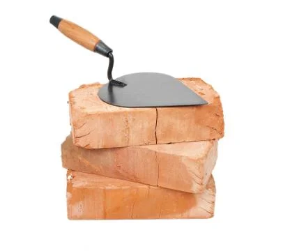 Trowel on bricks Stock Photos