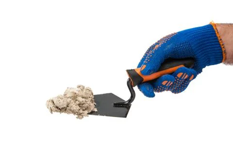 Trowel with mortar in the hand of the builder Stock Photos