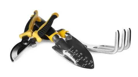 Trowel, pruning shears and rake on white background. Gardening tools Stock Photos