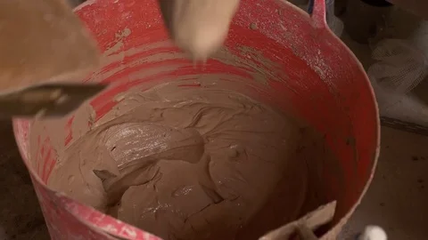 Trowelling plaster bucket hawk England April 2017 Stock-Footage 82008848