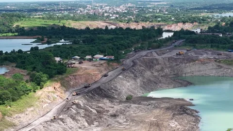 Truck activity transporting fill soil for the construction of hauling roads.. Video stock 342477036