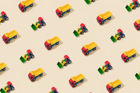 Truck and Tractor Creative Pattern on Yellow Background - Top View Stock-Fotos