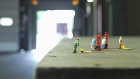 Truck backs up to loading dock, miniatures models in foreground Stock Footage 102554963